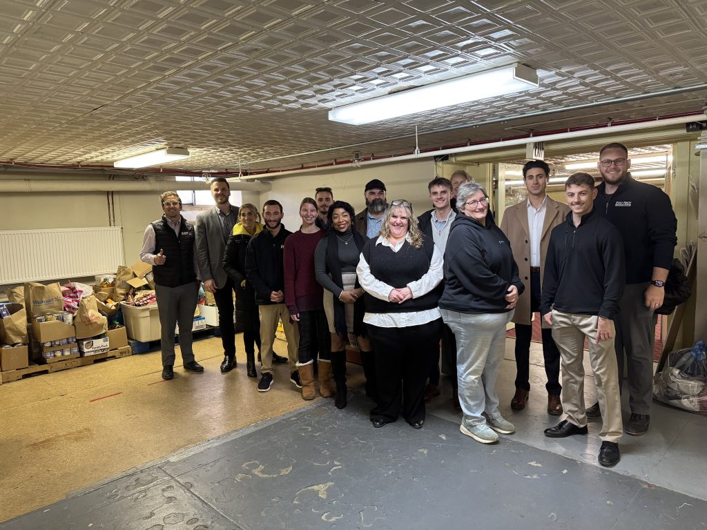 Steet Ponte Auto Group employees dropping off food donations to the Thea Bowman House in Utica, NY