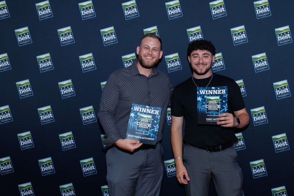 Dan DeLuke, Social Media Coordinator for the Auto Group and Vinny Ward, accepting the awards for Best New Car Dealer and Best Salesperson! 