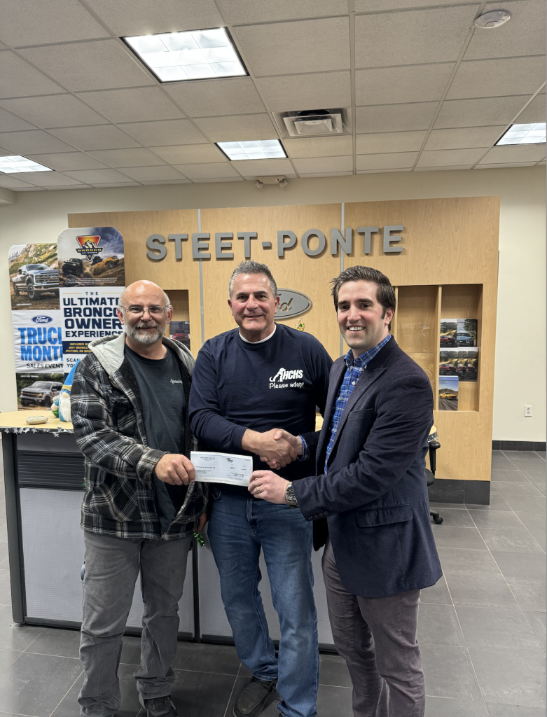 Joe Steet Jr. on right, with representatives from the Herkimer Humane Society presenting them with their check! 