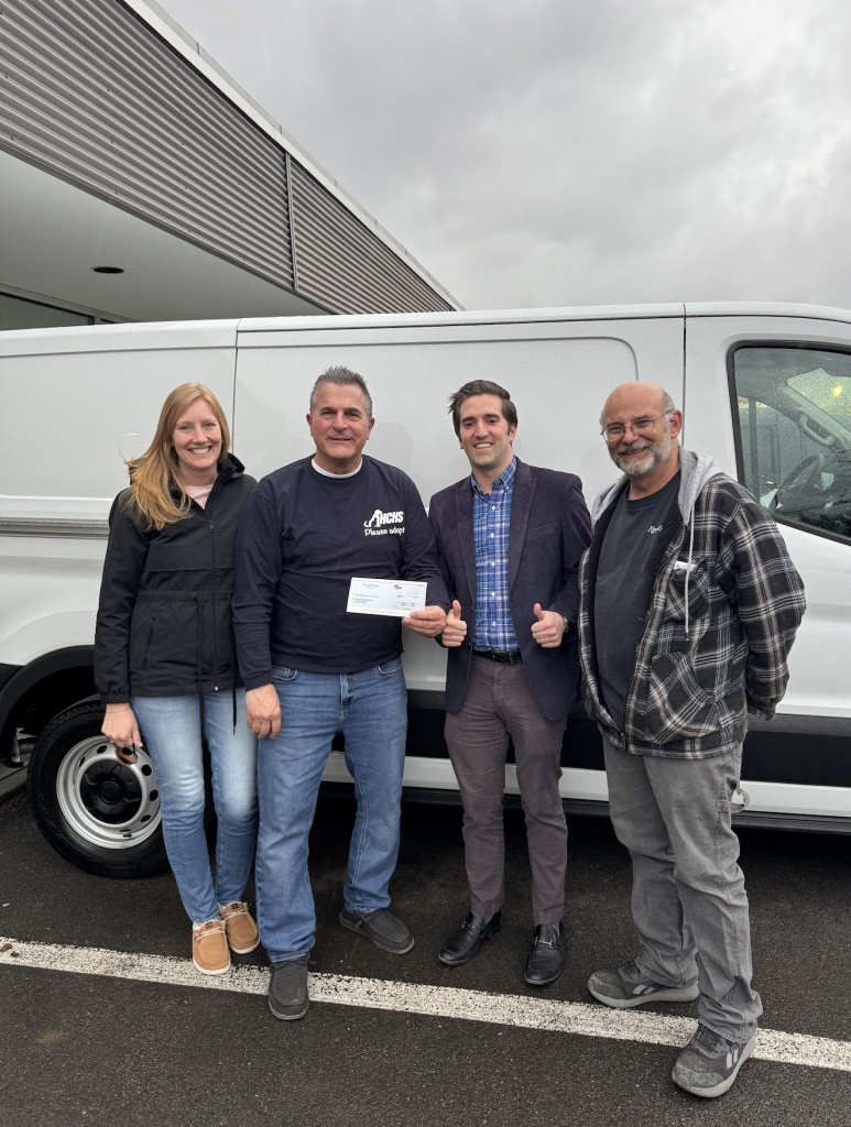 Joe Steet Jr. center, with representatives from the Herkimer Humane Society presenting them with their check in front of their Ford Transit Van!