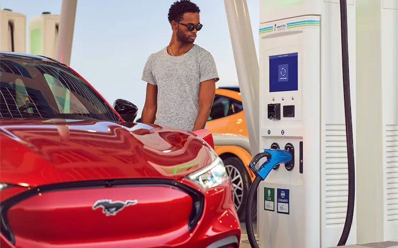 A Mustang Mach-E being charging in public